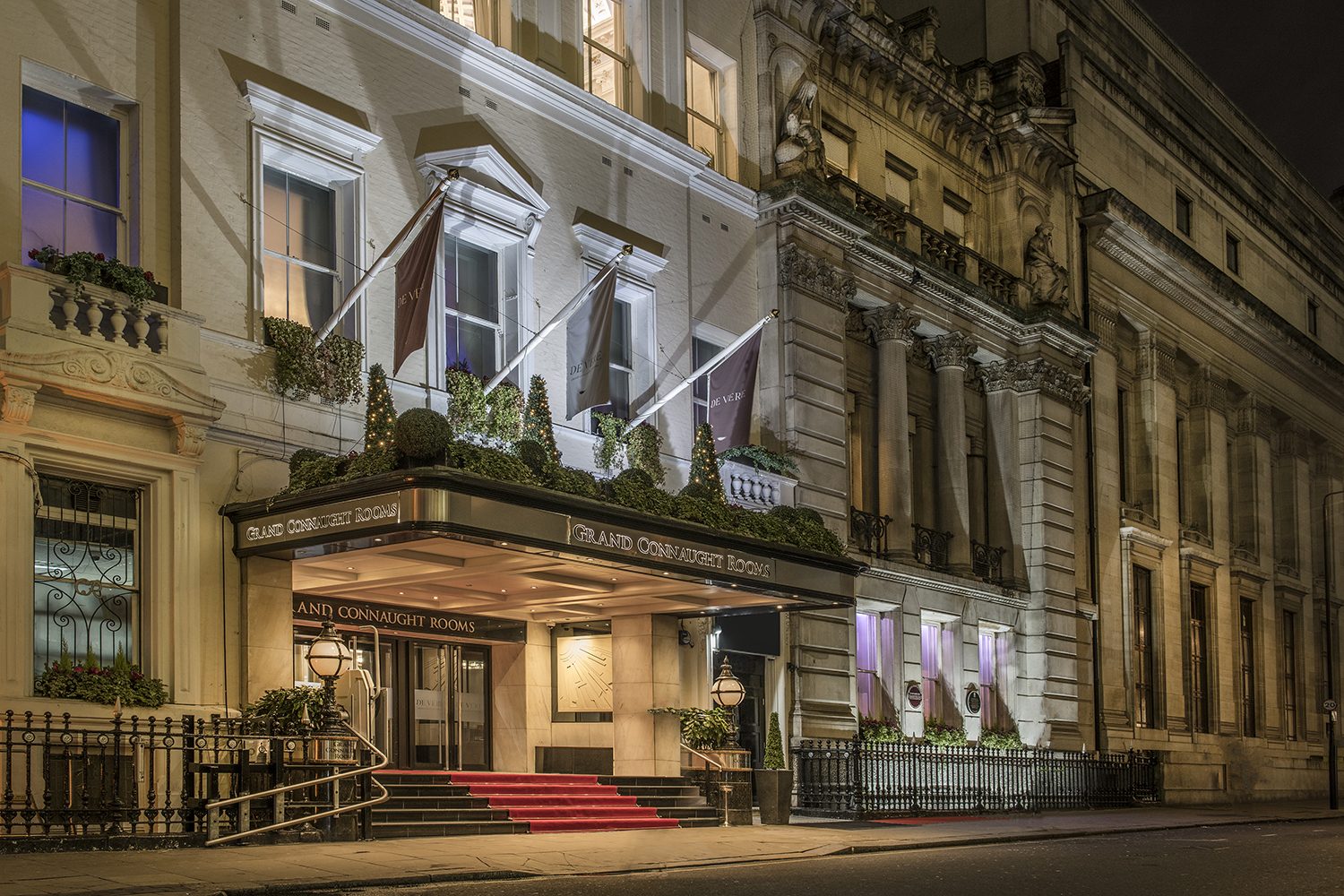 The De Vere Grand Connaught Rooms entrance on Great Queen Street, Covent Garden, lit in the evening